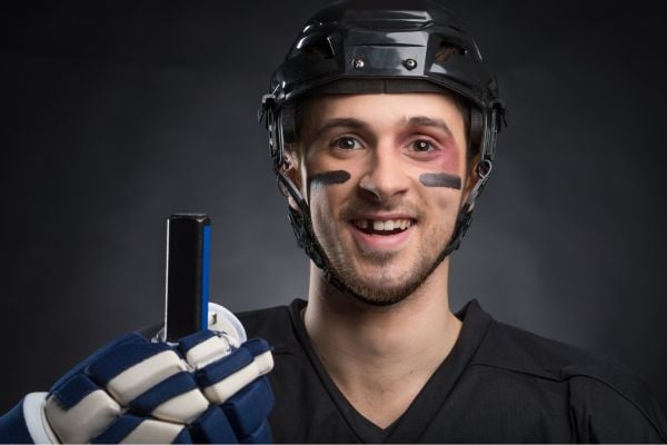 Image of an athlete missing a tooth